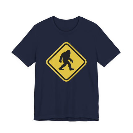 Sasquatch crossing warning sign graphic tee featuring a Bigfoot silhouette.