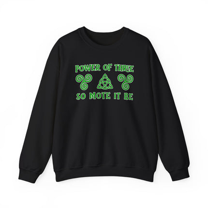 Power of Three So Mote It Be graphic on a black sweatshirt featuring Celtic triquetra and triskelion symbols.