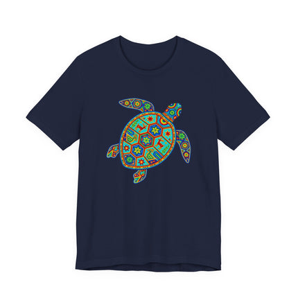 Vibrant Huichol-style sea turtle graphic tee featuring colorful Mexican folk art patterns.