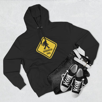 Sasquatch crossing warning sign graphic on a black Bigfoot hoodie.