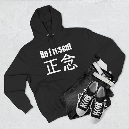 Black hoodie featuring "Be Present" and Zen Chinese characters for mindfulness and meditation apparel.