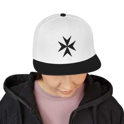 White snapback cap featuring a black embroidered Maltese Cross symbol.
