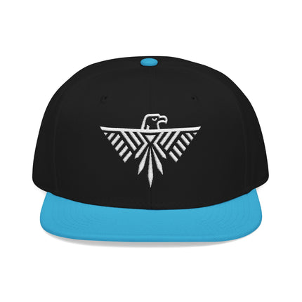 Black snapback hat with white geometric embroidery of a stylized eagle and tribal design.