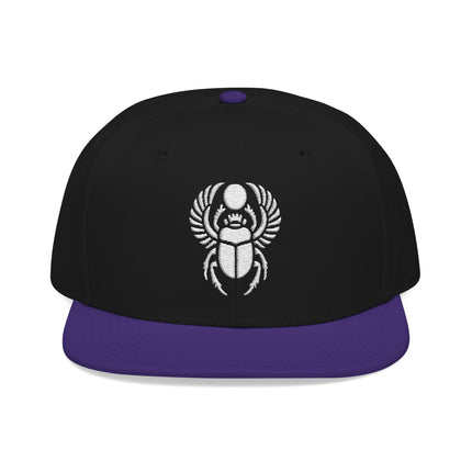 Black snapback cap featuring white embroidered Egyptian scarab beetle design.