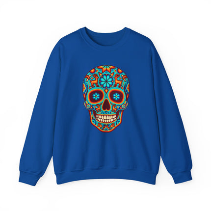 Colorful Huichol sugar skull graphic on a blue sweatshirt, Día de Muertos Mexican folk art design.