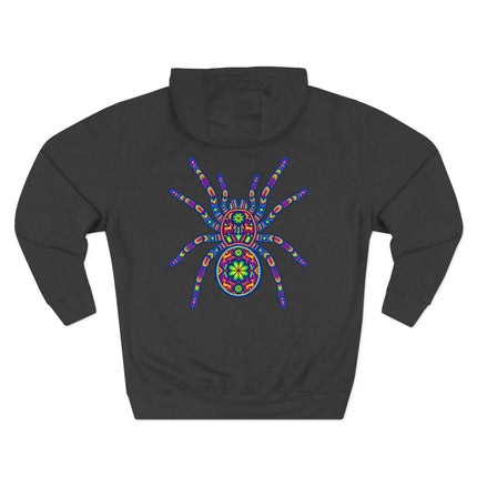 Vibrant Huichol folk art tarantula spider design on a dark pullover hoodie.