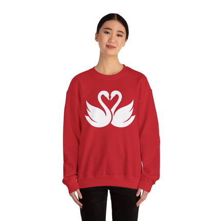 Swans forming a heart graphic on a red pullover sweatshirt.