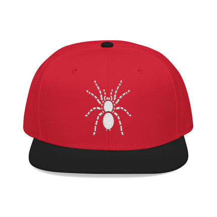 Red snapback cap featuring a white embroidered tarantula spider graphic.