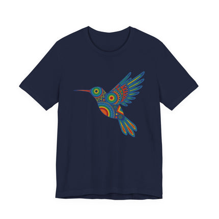 Vibrant Huichol hummingbird graphic tee featuring colorful Mexican folk art and geometric patterns.