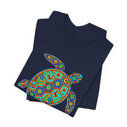 Colorful Huichol sea turtle graphic tee featuring vibrant Mexican folk art patterns.