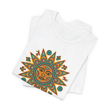 Vibrant Huichol sun face graphic tee featuring indigenous Mexican folk art and spiritual symbols.