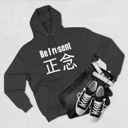 Black pullover hoodie featuring "Be Present" and "正念" text, promoting mindfulness, meditation, and zen living.
