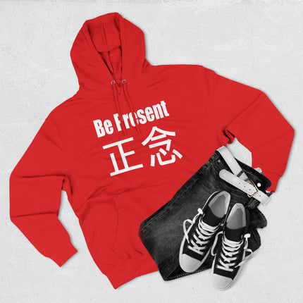 Red hoodie featuring "Be Present" and 正念 kanji, a mindful meditation design for spiritual streetwear.