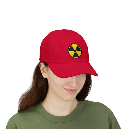 Red baseball cap with embroidered yellow radioactive hazard symbol.