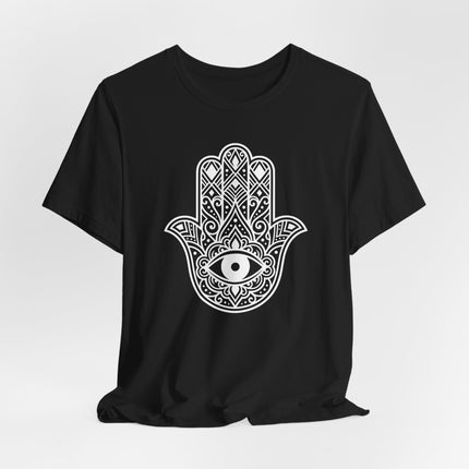 White Hamsa hand and Evil Eye graphic on a black t-shirt. Protection symbol tee featuring Hand of Fatima design.