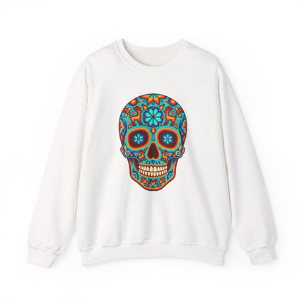 Colorful Huichol sugar skull graphic on a white sweatshirt, featuring vibrant Mexican Día de Muertos folk art.