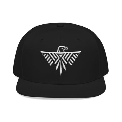 Black snapback hat with white embroidered geometric eagle and tribal design.