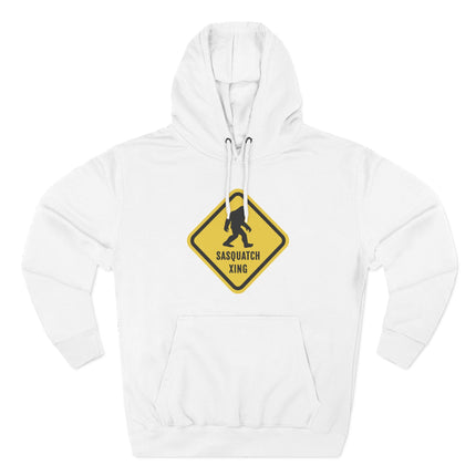 Yellow Sasquatch crossing warning sign graphic on a white pullover hoodie.