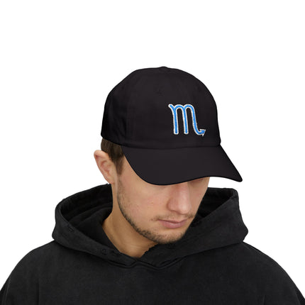 Black dad cap featuring blue embroidered Scorpio zodiac symbol.
