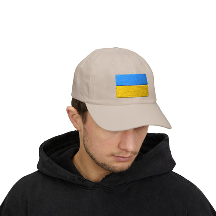 Tan baseball cap featuring embroidered Ukrainian flag for support.