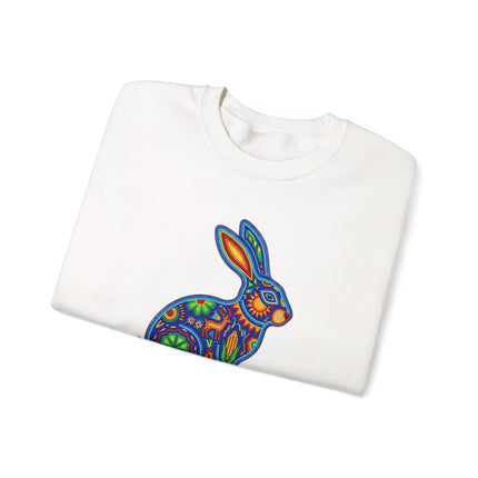 Colorful Huichol beaded rabbit art sweatshirt featuring Mexican folk designs.