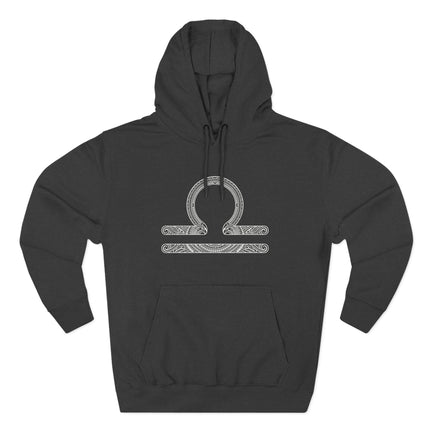 Intricate Libra zodiac scales symbol design on a black hoodie.