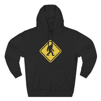 Bigfoot warning sign graphic on a black hoodie featuring a Sasquatch silhouette.
