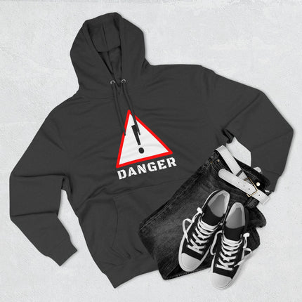 Black streetwear hoodie featuring a red triangular danger warning sign and exclamation mark graphic.