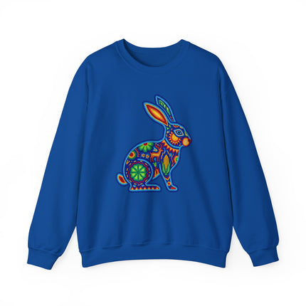 Vibrant Huichol beaded rabbit folk art graphic on a royal blue sweatshirt.