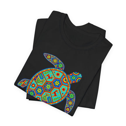 Colorful Huichol sea turtle graphic tee featuring vibrant Mexican folk art patterns on a black shirt.