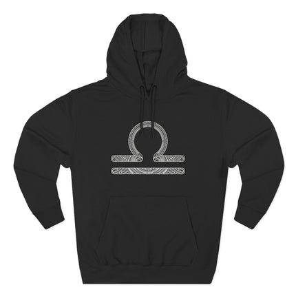 Intricate Libra zodiac scales symbol design on a black pullover hoodie.