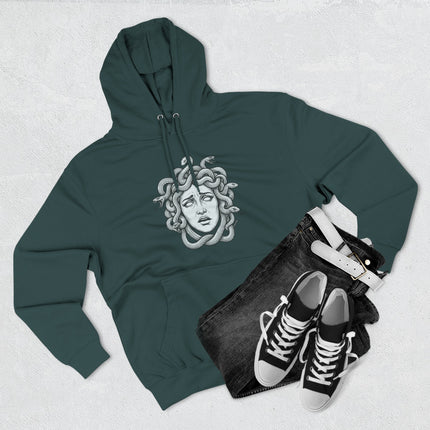 Medusa Gorgon head graphic featuring snakes, printed on a dark pullover hoodie.