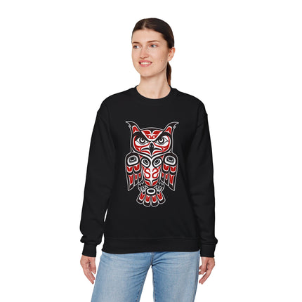 Red and black Pacific Northwest owl formline art on a black sweatshirt.