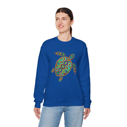 Huichol art geometric turtle print on a blue sweatshirt. Vibrant Mexican folk design.