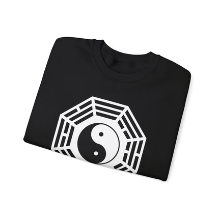 Yin Yang and Bagua symbol graphic on black pullover, representing Eastern philosophy and harmony.