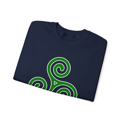Celtic triskelion spiral knotwork design on a navy blue sweatshirt.