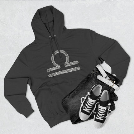 Intricate Libra zodiac symbol on a black pullover hoodie for astrology fans.