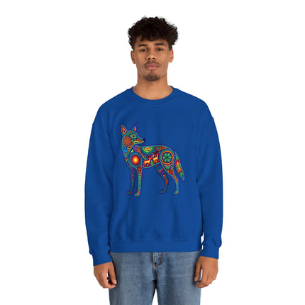 Vibrant Huichol art coyote graphic on a blue sweatshirt, featuring Mexican folk art and spiritual symbols.