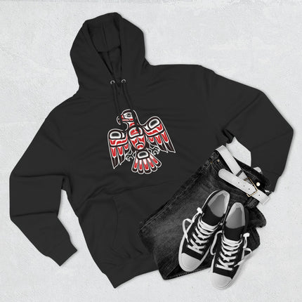 Red and black stylized hawk graphic featuring Northwest Coast tribal art in formline style.