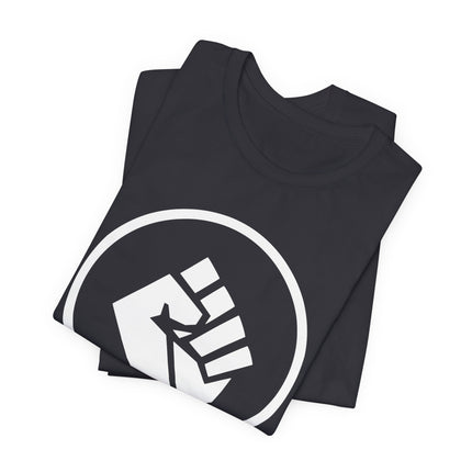 Raised fist symbol on black t-shirt, representing solidarity, power, and resistance.