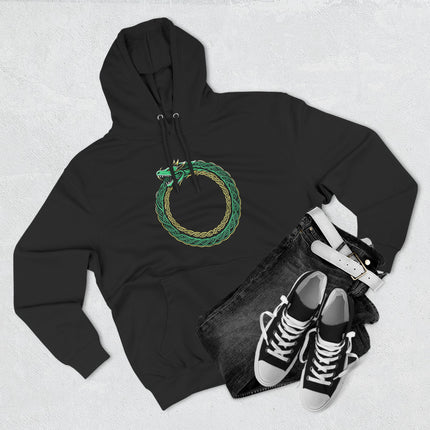Norse Ouroboros dragon knotwork symbol in green and gold.