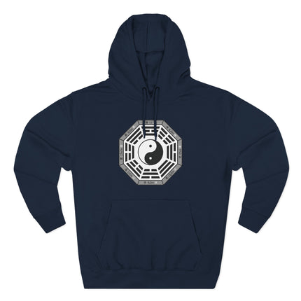 Yin Yang and Bagua trigrams graphic on a dark blue hoodie, symbolizing universal balance and I Ching philosophy.