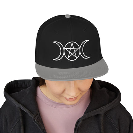 Black snapback cap with embroidered triple moon and pentagram occult symbol.