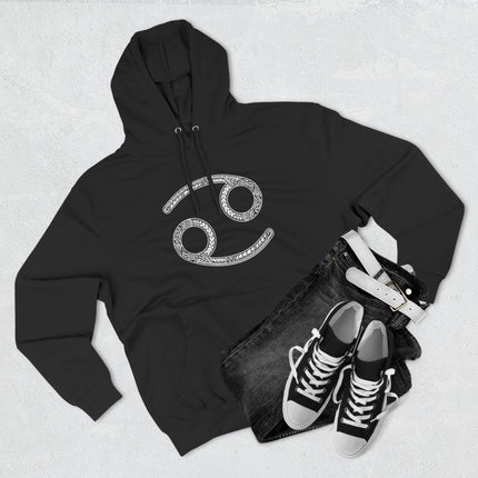 Black hoodie featuring an ornate Cancer zodiac sign. Intricate astrology celestial art for zodiac lovers.