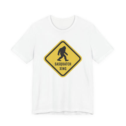 Sasquatch crossing warning sign graphic on a white t-shirt.