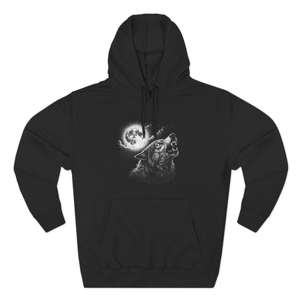 Howling wolf under a full moon and celestial night sky graphic on a black pullover hoodie.
