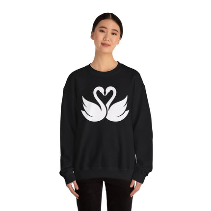 Swans forming a heart graphic on a black pullover sweatshirt.