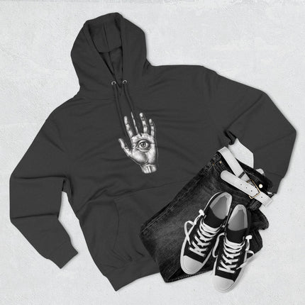 Black hoodie featuring an all-seeing eye graphic in an open hand. Mystic spiritual streetwear apparel.