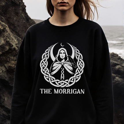 Celtic knotwork graphic of The Morrigan goddess with moon and raven symbols on a black sweatshirt.