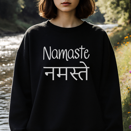 Namaste Devanagari graphic on black unisex cultural sweatshirt.